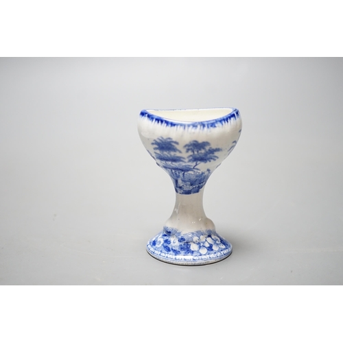 532 - A Spode blue and white transfer printed pottery eye bath, early 19th century decorated with a landsc... 