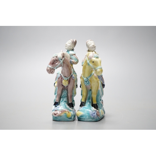 547 - A pair of early 20th century Chinese equestrian groups, 9cm tall