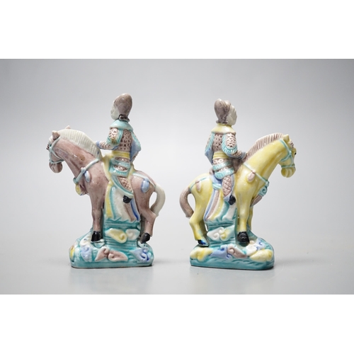 547 - A pair of early 20th century Chinese equestrian groups, 9cm tall