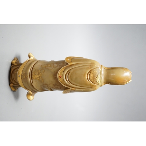 550 - A Chinese gilded and polychrome soapstone figure of Guanyin, 16cm