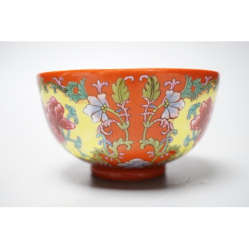 559 - A Chinese famille rose coral ground bowl, 11cm diameter