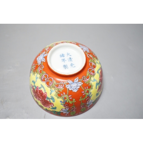 559 - A Chinese famille rose coral ground bowl, 11cm diameter