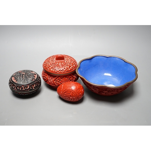 597 - A Chinese cinnabar lacquer bowl, a similar covered box and egg, and a carved circular box and cover... 