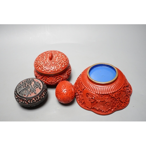 597 - A Chinese cinnabar lacquer bowl, a similar covered box and egg, and a carved circular box and cover... 