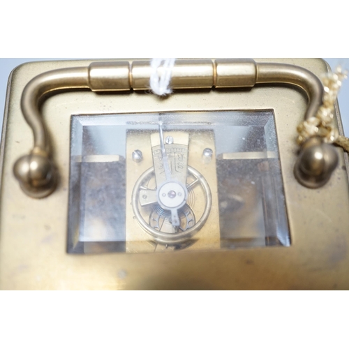 609 - A brass carriage timepiece together with a gold plated pocket watch