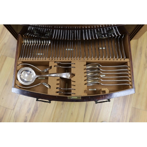 612 - A suite of cutlery, in mahogany two drawer cabinet