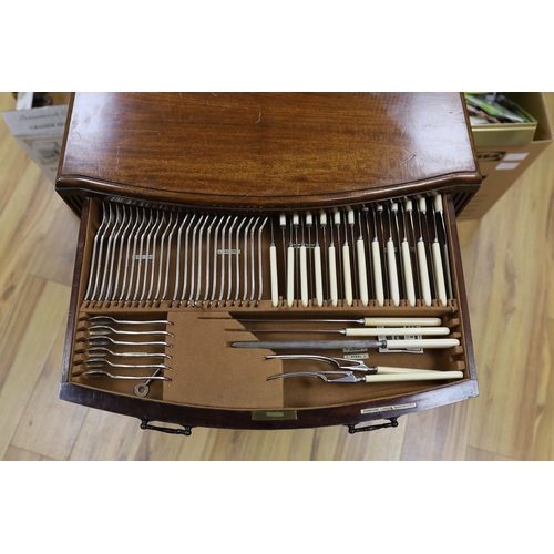 612 - A suite of cutlery, in mahogany two drawer cabinet