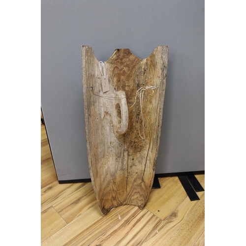 614 - A Tasmanian carved wood shield, 77cm