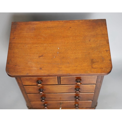 624 - A Victorian miniature chest with five drawers and a key, 38cm tall