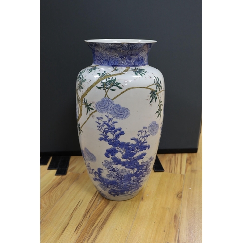 635 - A massive Japanese underglaze blue and enamelled vase, Meiji period, 62cm