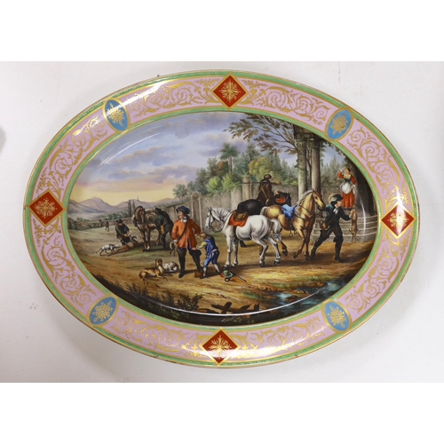 638 - A large Vienna style porcelain oval dish, late 19th century, painted with huntsmen and horses in a l... 