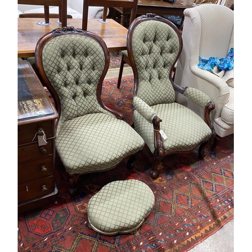 70 - A pair of Victorian carved walnut spoon back chairs, one with arms together with a similar footstool... 