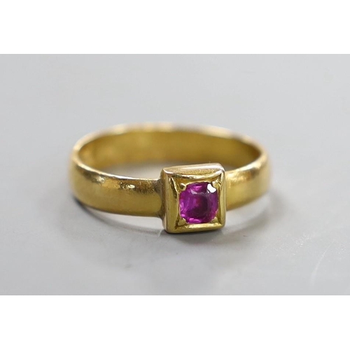 920 - A Victorian 22ct gold and single stone gypsy set ruby ring, size M, gross weight 3.9 grams.