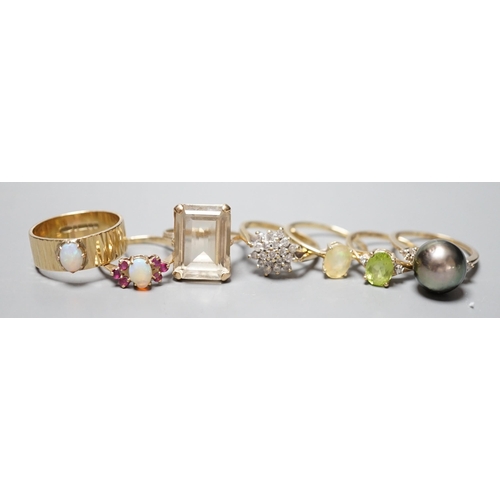 927 - Seven assorted modern 9ct gold and gem set dress rings, including diamond cluster, white opal and wh... 