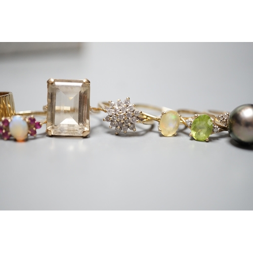 927 - Seven assorted modern 9ct gold and gem set dress rings, including diamond cluster, white opal and wh... 