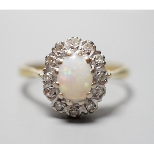 928 - A modern 18ct gold, white opal and diamond chip set oval cluster ring, size N, gross weight 3.6 gram... 