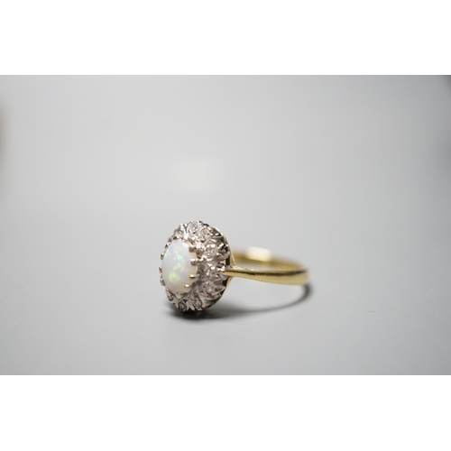 928 - A modern 18ct gold, white opal and diamond chip set oval cluster ring, size N, gross weight 3.6 gram... 