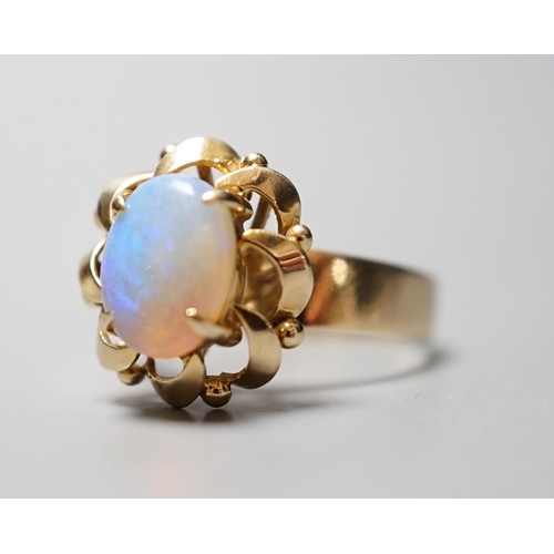 929 - A 14k yellow metal and white opal set oval dress ring, size O, gross weight 3.9 grams.