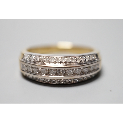 932 - A modern 18ct gold and three row diamond set half eternity ring, size P, gross weight 6.8 grams.... 