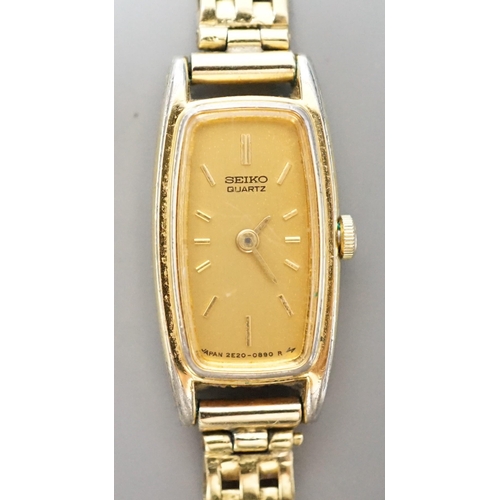 934 - A lady's steel and gold plated Seiko quartz wrist watch, on an 18ct gold bracelet, gross weight 16.7... 