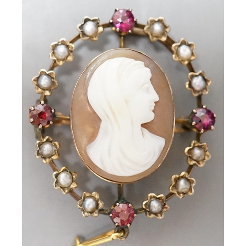 936 - An Edwardian yellow metal, split pearl and ruby mounted oval cameo shell pendant brooch, 32mm, gross... 