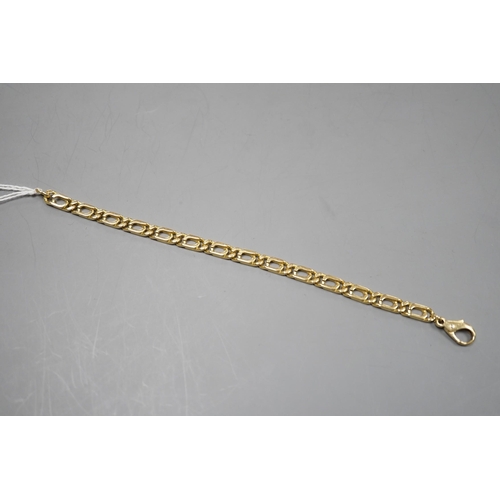 943 - A modern 750 yellow metal rectangular link bracelet, 18cm, 18 grams.