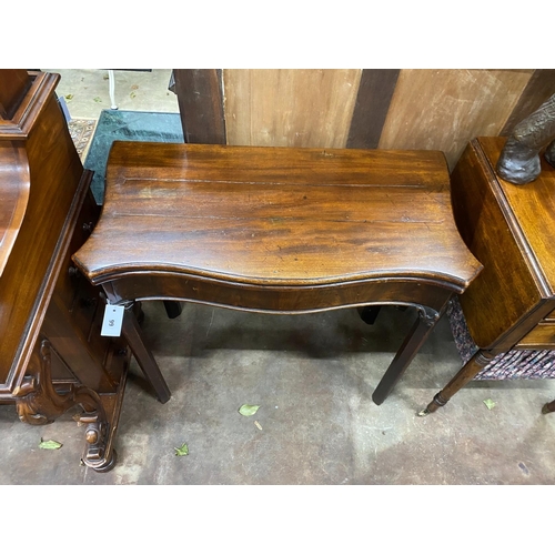 99 - A George III serpentine mahogany foding card table, width 80cm, depth 40cm, height 73cm