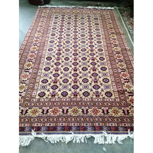 1005 - A Hamadan carpet with central field of foliate motifs on a sand coloured ground, 300 x 195cm