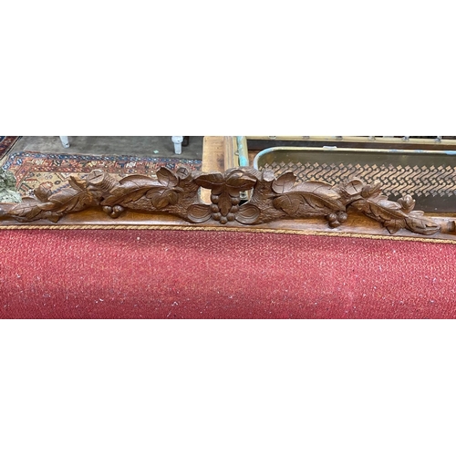 1010 - A 19th century French mahogany show-frame settee, width 1832cm