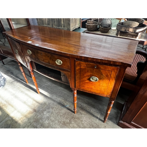 1020 - A Regency mahogany bowfronted sideboard, length 153cm, depth 58cm, height 92cm
