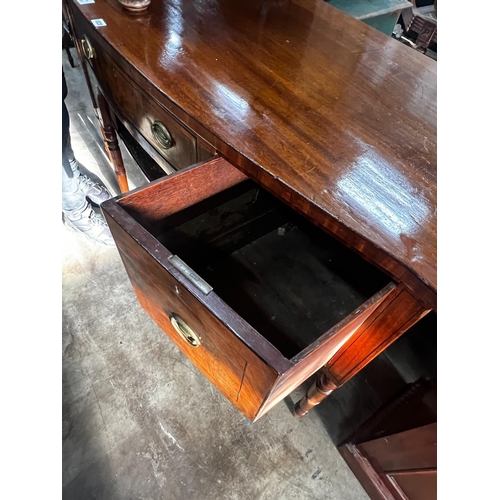 1020 - A Regency mahogany bowfronted sideboard, length 153cm, depth 58cm, height 92cm