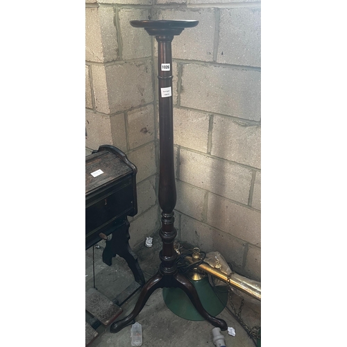 1026 - A George III style mahogany tripod torchere, height 134cm