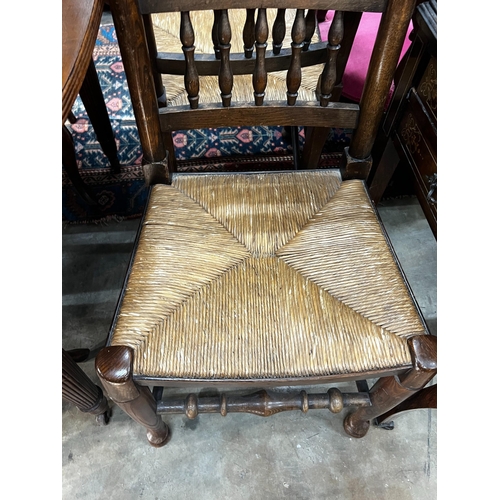 1036 - A pair of Lancashire elm and beech rush seat chairs
