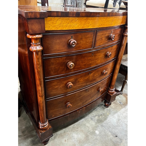 1039 - A large mid Victorian mahogany bow front chest of two short and three long drawers, bird's eye maple... 