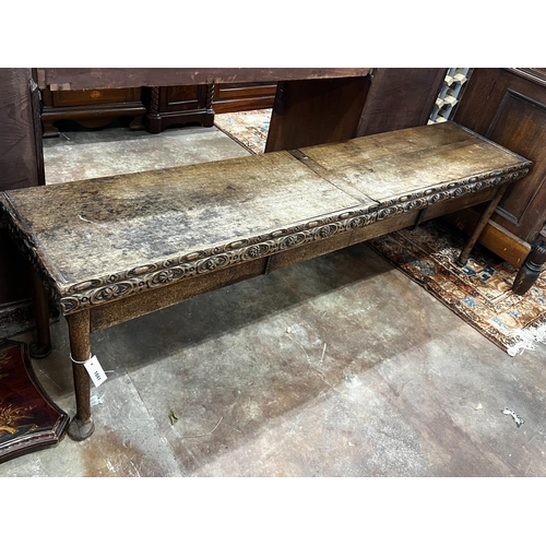 1041 - An 18th century and later carved oak hall bench with twin hinged box seat, width 183cm, depth 40cm, ... 