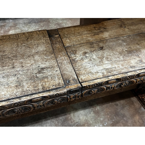 1041 - An 18th century and later carved oak hall bench with twin hinged box seat, width 183cm, depth 40cm, ... 