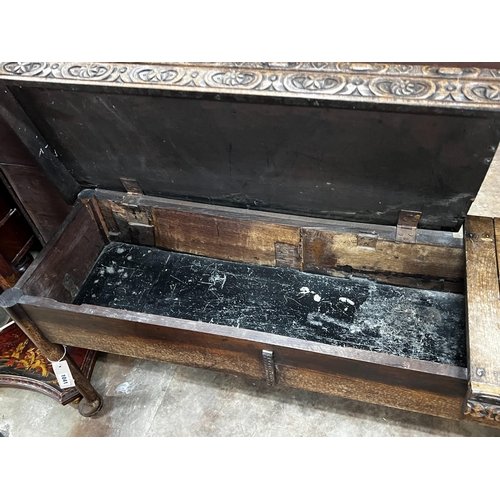 1041 - An 18th century and later carved oak hall bench with twin hinged box seat, width 183cm, depth 40cm, ... 