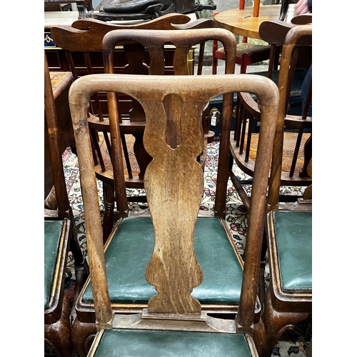 1045 - A set of six Georgian walnut dining chairs