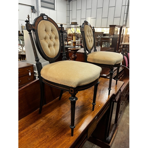1050 - A pair of late Victorian ebonised side chairs