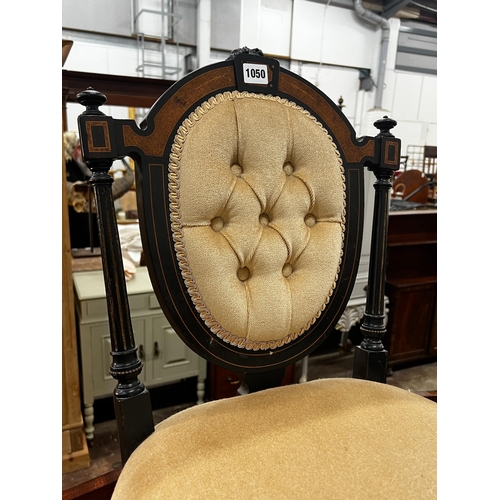 1050 - A pair of late Victorian ebonised side chairs