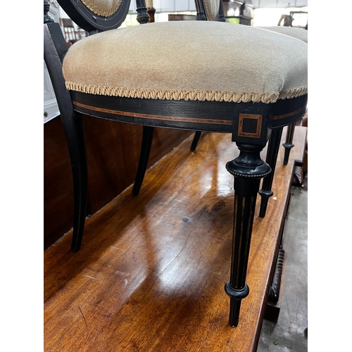 1050 - A pair of late Victorian ebonised side chairs