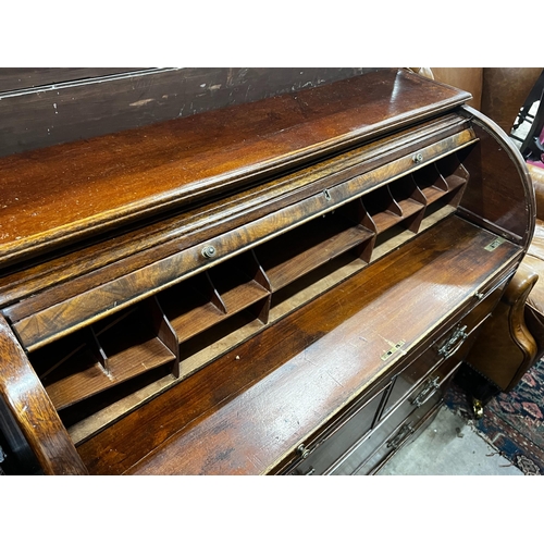 1052 - A mahogany tambour fronted cylinder bureau, width 105cm, depth 45cm, height 95cm
