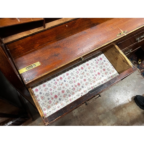 1052 - A mahogany tambour fronted cylinder bureau, width 105cm, depth 45cm, height 95cm