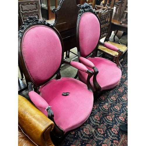 1054 - A near pair of 19th century French rosewood upholstered armchairs, larger width 61cm, depth 56cm, he... 