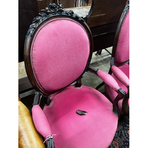 1054 - A near pair of 19th century French rosewood upholstered armchairs, larger width 61cm, depth 56cm, he... 