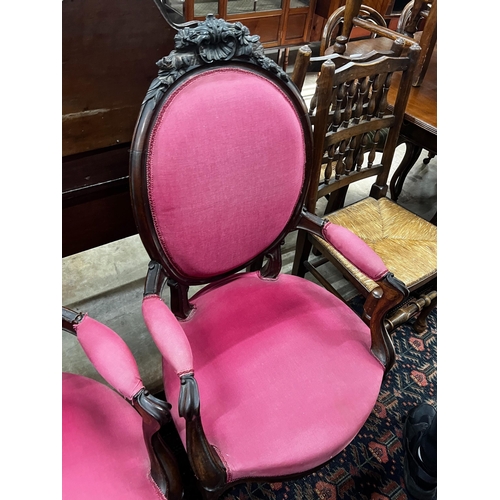 1054 - A near pair of 19th century French rosewood upholstered armchairs, larger width 61cm, depth 56cm, he... 