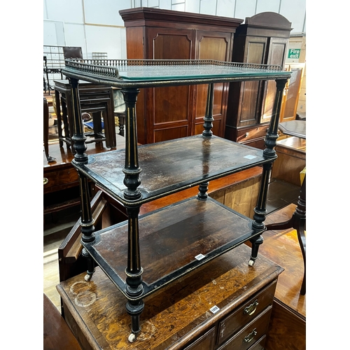 1057 - A late Victorian ebonised and amboyna three tier whatnot, width 66cm, depth 39cm, height 81cm