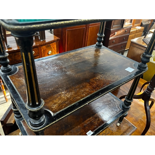 1057 - A late Victorian ebonised and amboyna three tier whatnot, width 66cm, depth 39cm, height 81cm