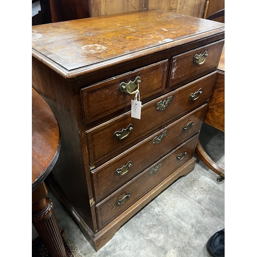 1058 - A George III mahogany banded oak chest of drawers, width 81cm, depth 49cm, height 92cm