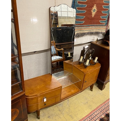 1015 - A 1960's mahogany mirrored dressing table, width 150cm, depth 38cm, height 154cm